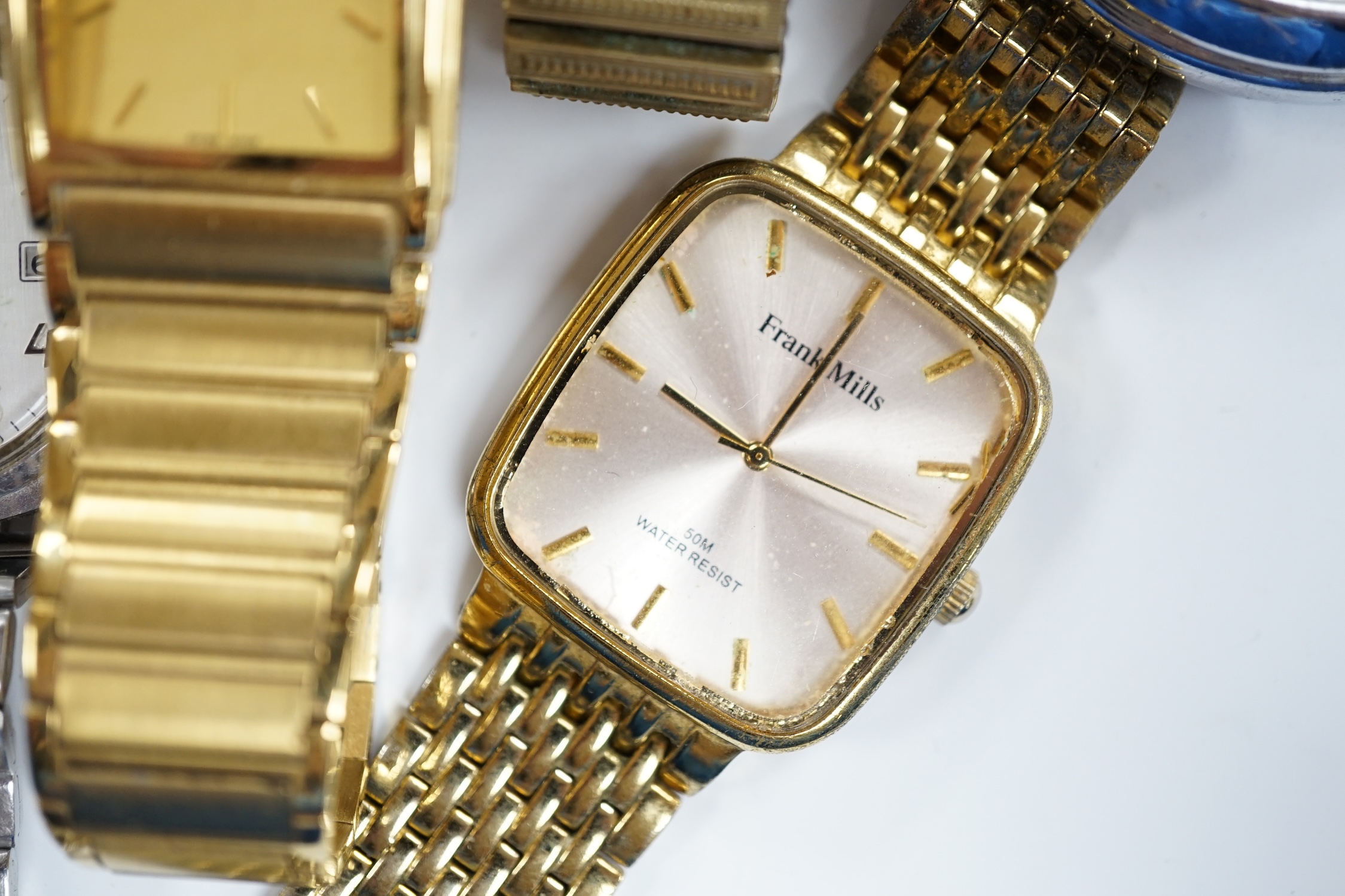 A small group of assorted wrist and pocket watches including a gold plated hunter and a Roamer Searock.